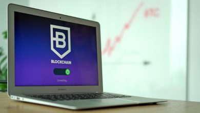 Laptop and cryptocurrency imagery representing cybercrime and illicit finance networks
