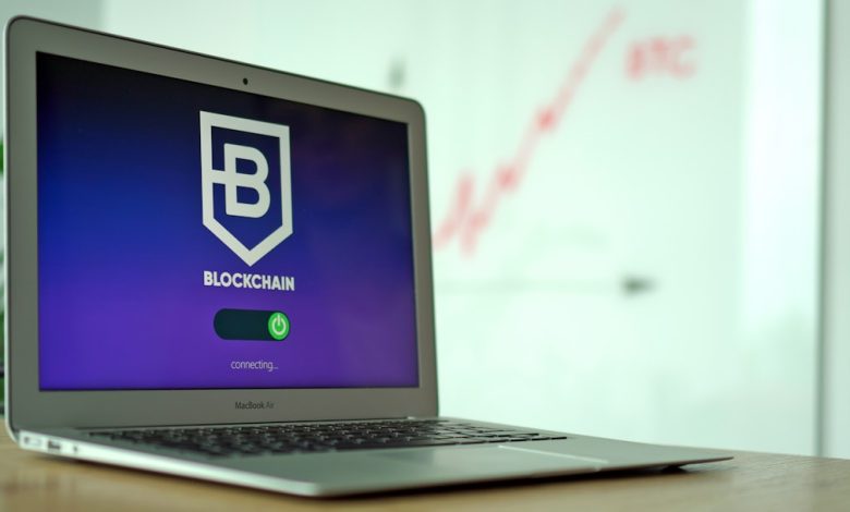 Laptop and cryptocurrency imagery representing cybercrime and illicit finance networks
