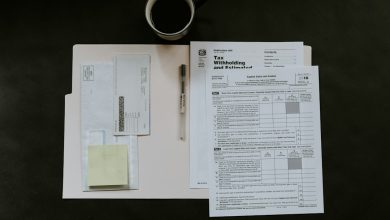 Generic financial documents illustration for a money-laundering enforcement article. Photo by Kelly Sikkema on Unsplash.